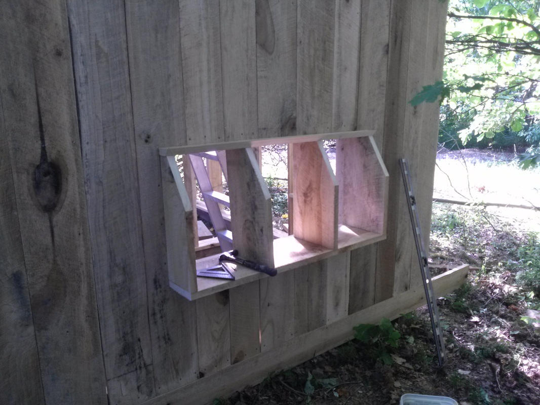 As I sided the gable end on the coop, I decided to build the nest 